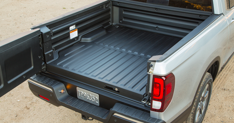 Illustration for article titled A Human Being Can Fit In The 2017 Honda Ridgeline's In-Bed Trunk